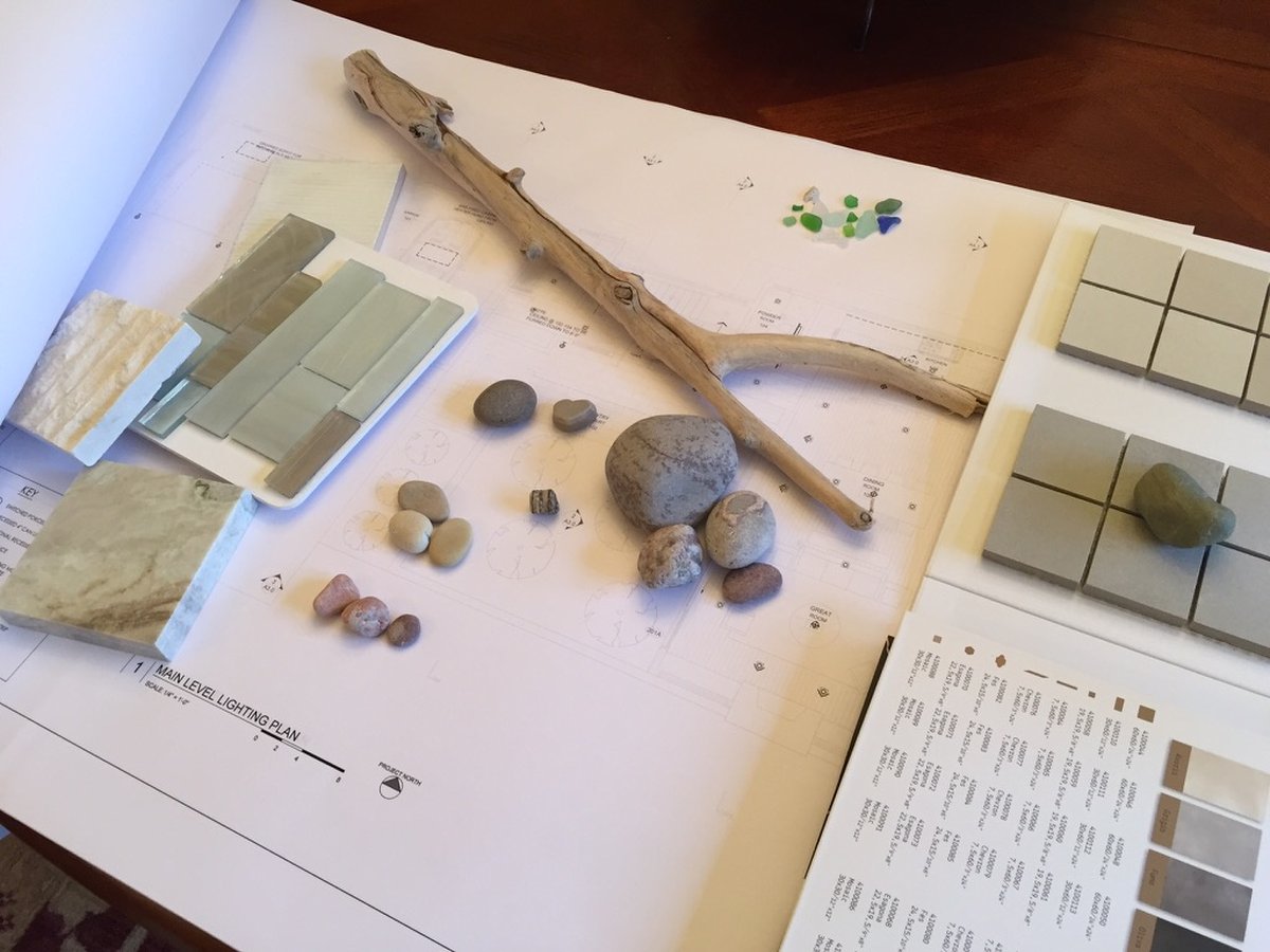 Design materials and floor plans laid out during project planning at Twig and Trove Interiors