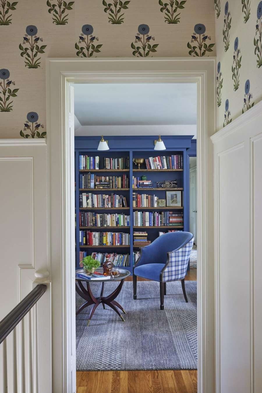 Finished library and hallway with botanical wallpaper, a Twig and Trove Interiors residential project